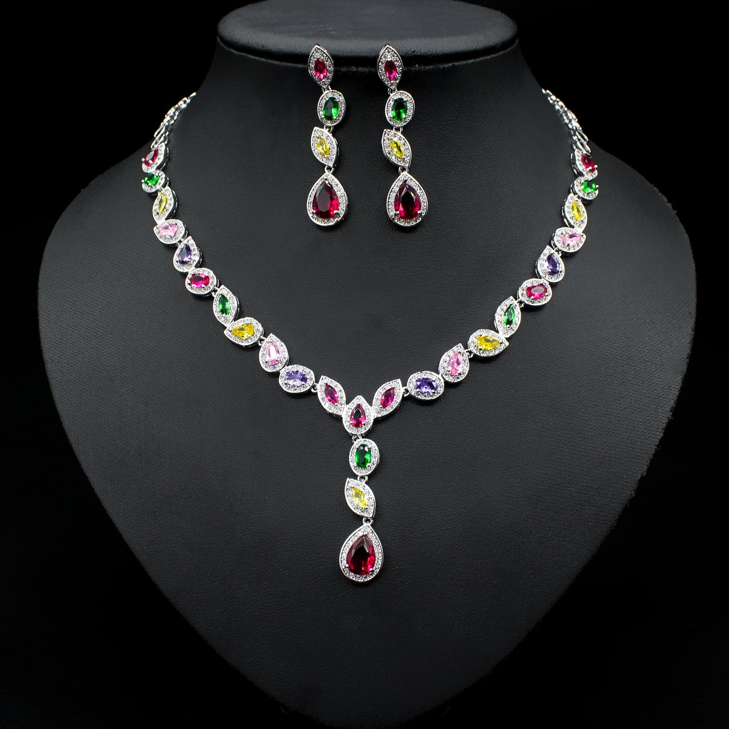 a necklace and earring set with multicolored stones