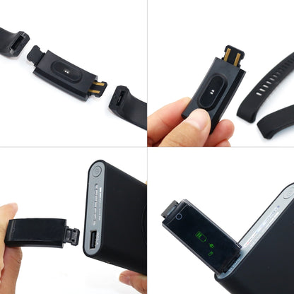 a hand holding a cell phone and charging it