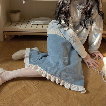 A Woman Wearing A Sweater With A Base Top