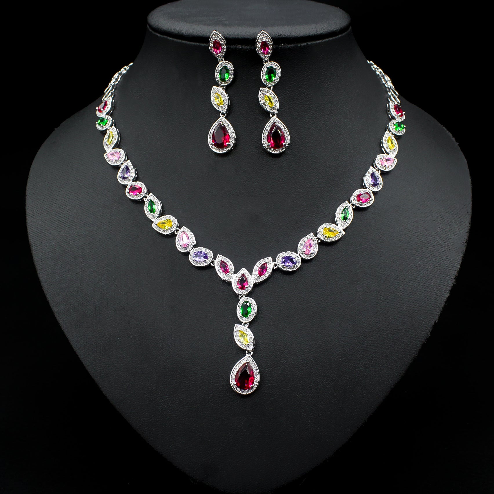 a necklace and earring set with multicolored stones